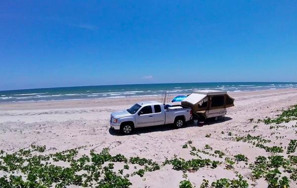 popup camper on the beach